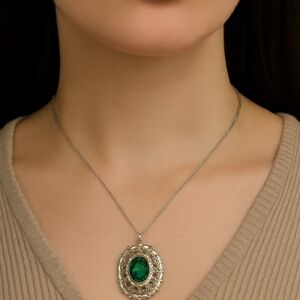 Vintage gold Coro pendant with green costume stone